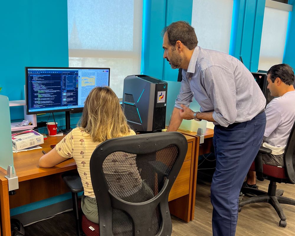 Ali Etemad with students in his lab
