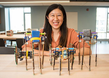 Woman showing a robot