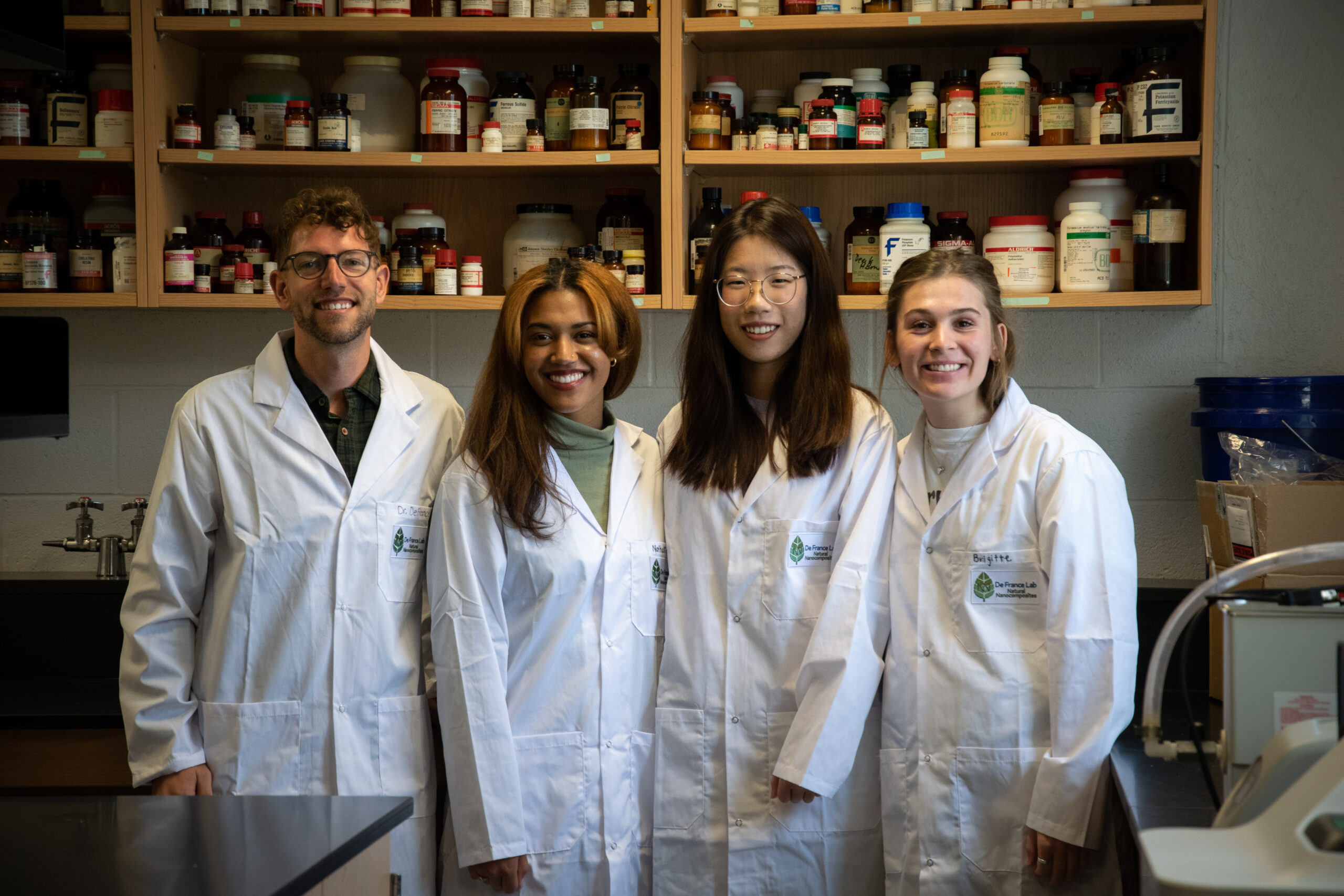 Brigitte Gaudert with Dr. Kevin De France and other members of his research lab. 