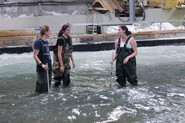female grad students in the water at the Coastal Lab