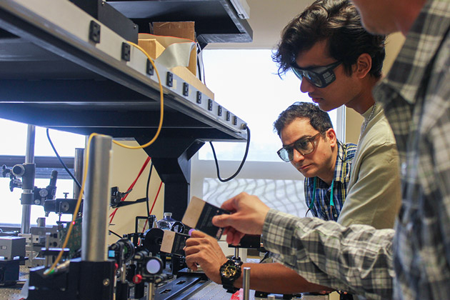 hands doing things with equiment in a lab