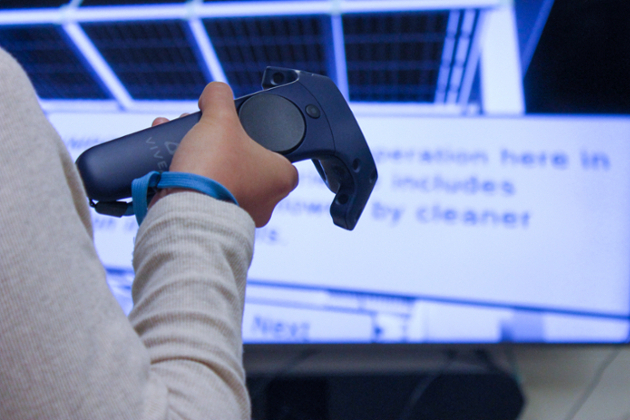 closeup of hand holding VR device